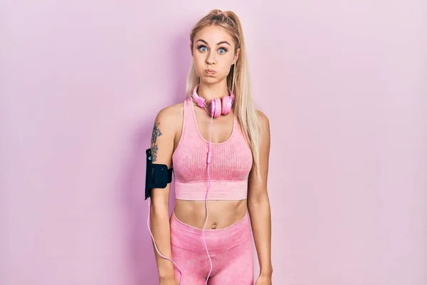 Young Beautiful Caucasian Woman Wearing Gym Clothes Using Headphones Puffing — 스톡 사진