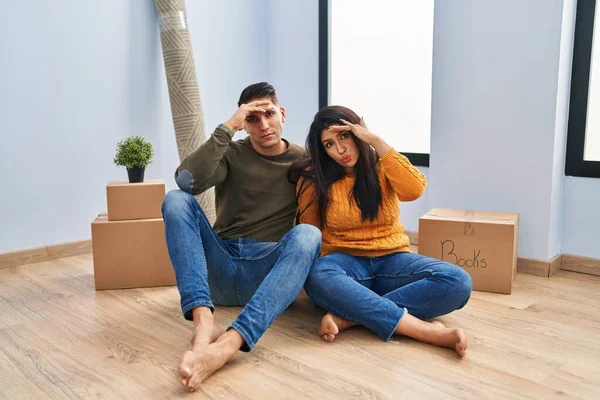 Young Couple Sitting Floor New Home Worried Stressed Problem Hand — Stock Photo, Image