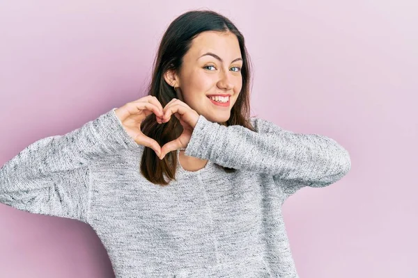 Young Brunette Woman Wearing Casual Sweater Smiling Love Doing Heart — Stok fotoğraf