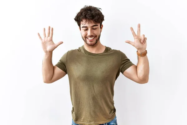 Hispanic Man Standing Isolated White Background Showing Pointing Fingers Number — Stockfoto