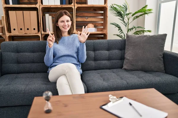 Young Brunette Woman Consultation Office Showing Pointing Fingers Number Six — Stock Photo, Image