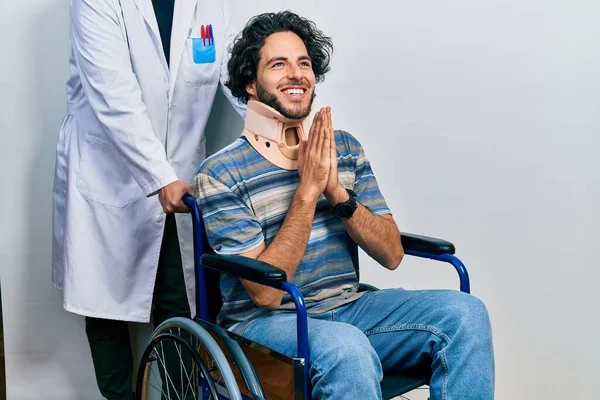 Handsome Hispanic Man Sitting Wheelchair Wearing Neck Collar Praying Hands — Stock Photo, Image