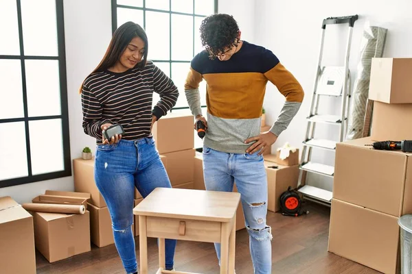 Young Latin Couple Smiling Happy Assembling Piece Furniture New Home — Foto de Stock