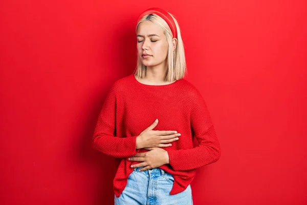 Beautiful Blonde Woman Wearing Casual Red Sweater Hand Stomach Because — 스톡 사진