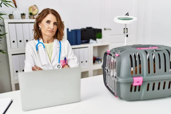 Middle Age Veterinarian Woman Working Pet Clinic Skeptic Nervous Disapproving — Photo