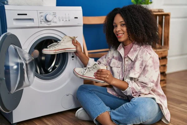 Young African American Woman Smiling Confident Washing Sneakers Laundry — Fotografia de Stock