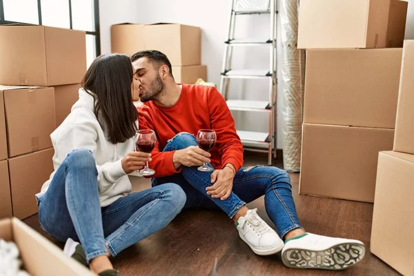 Young Latin Couple Kissing Toasting Red Wine New Home — Stock Photo, Image