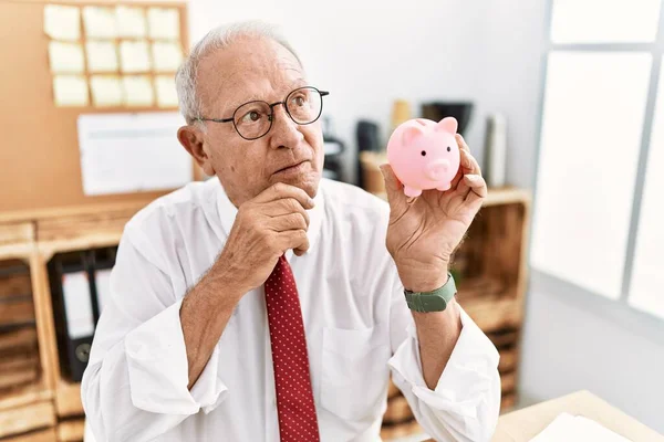Senior Business Man Holding Piggy Bank Serious Face Thinking Question — Stock Photo, Image