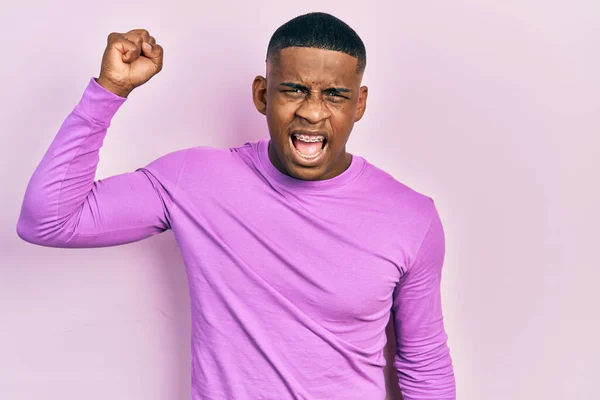 Young Black Man Wearing Casual Pink Sweater Angry Mad Raising — Foto de Stock