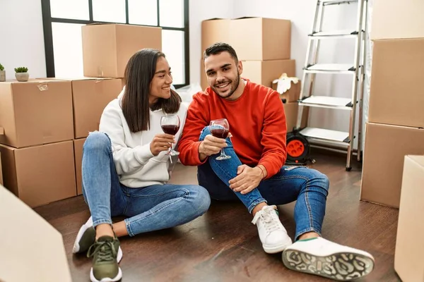 Young Latin Couple Smiling Happy Toasting Red Wine New Home — Stock Photo, Image