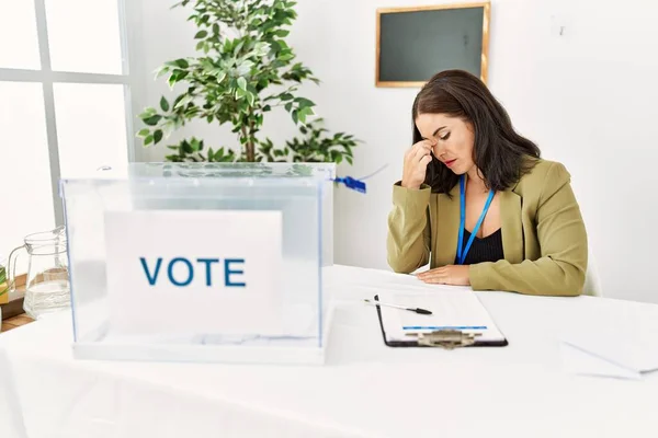 Young Brunette Woman Sitting Election Table Voting Ballot Tired Rubbing — Stock Photo, Image