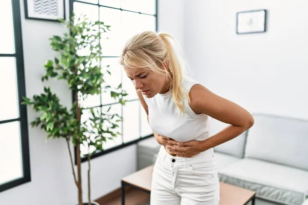 Young Caucasian Woman Standing Living Room Hand Stomach Because Nausea — Stock Photo, Image