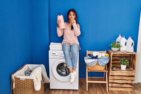 Young Caucasian Woman Sitting Washing Machine Holding Detergent Bottle Covering Royalty Free Stock Photos