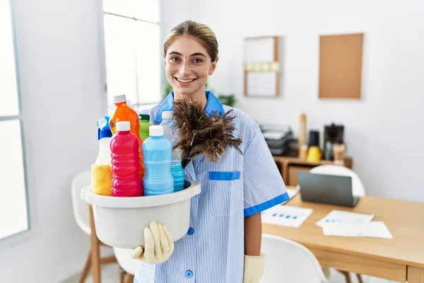Young Blonde Woman Wearing Cleaner Uniform Holding Cleaning Products Happy — Stock Photo, Image