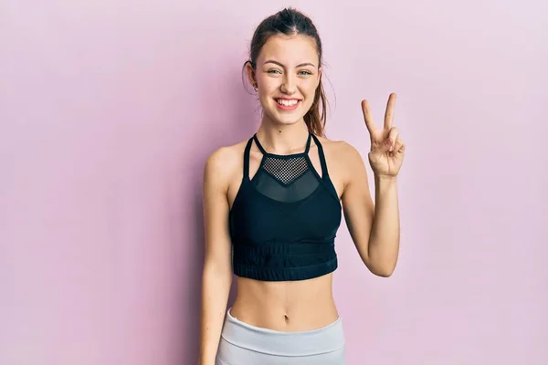 Young Brunette Woman Wearing Sportswear Smiling Happy Face Winking Camera — Stock Photo, Image