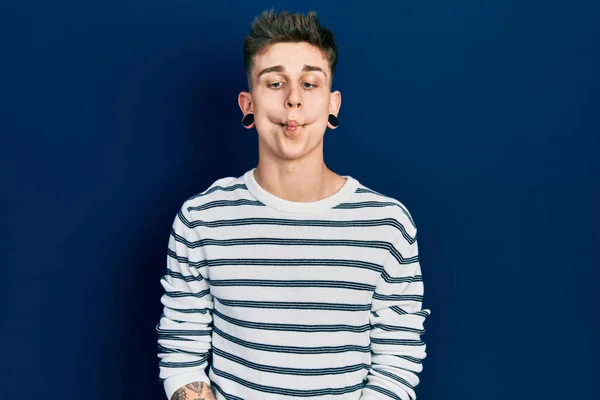 Young Caucasian Boy Ears Dilation Wearing Casual Striped Shirt Making — Stok fotoğraf