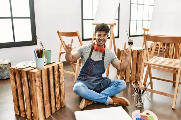 Young Hispanic Man Sitting Art Studio Shouting Crazy Expression Doing — 图库照片