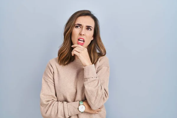 Young Woman Standing Isolated Background Thinking Worried Question Concerned Nervous — 스톡 사진