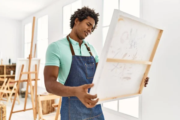 Young African American Artist Man Serious Expression Holding Canvas Art — Stockfoto