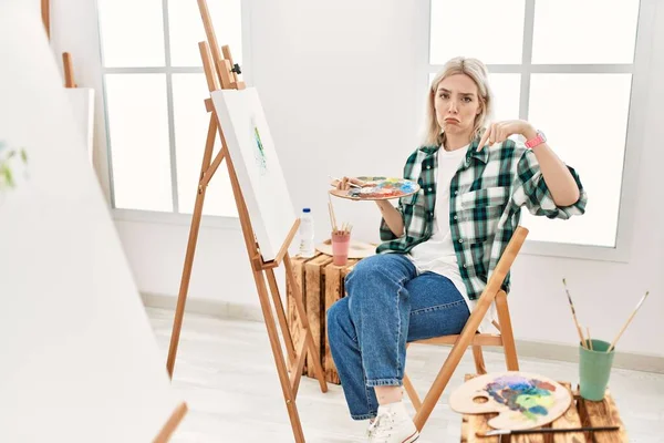 Young Artist Woman Painting Canvas Art Studio Pointing Looking Sad — Stock Photo, Image