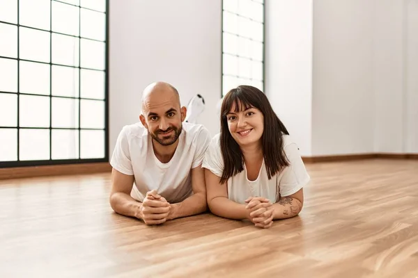 Young Hispanic Couple Smiling Happy Lying Floor Empty New Home — Stock Photo, Image