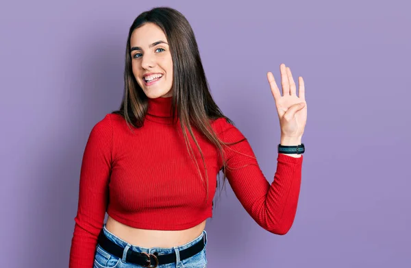 Young Brunette Teenager Wearing Red Turtleneck Sweater Showing Pointing Fingers — Stock Photo, Image