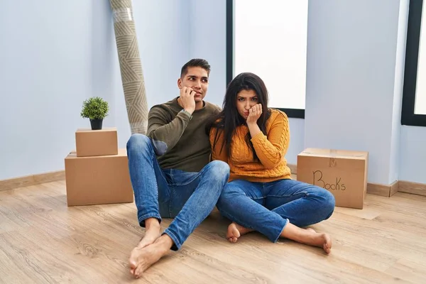 Young Couple Sitting Floor New Home Looking Stressed Nervous Hands — Stock Photo, Image