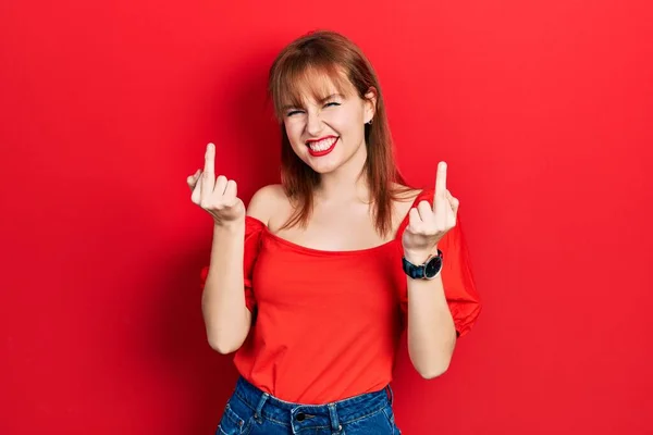Redhead Young Woman Wearing Casual Red Shirt Showing Middle Finger — Stok Foto
