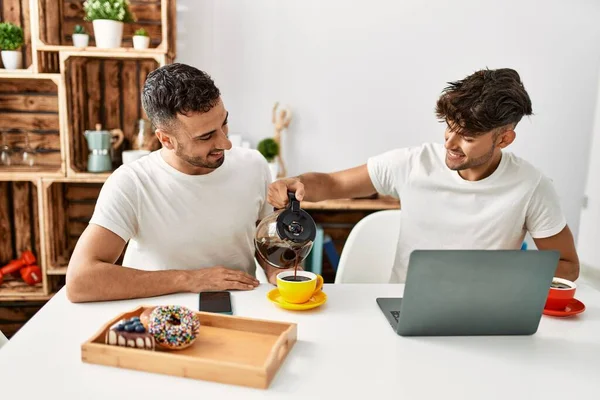 Two Hispanic Men Couple Pouring Coffee Having Breakfast Home — Stock Photo, Image