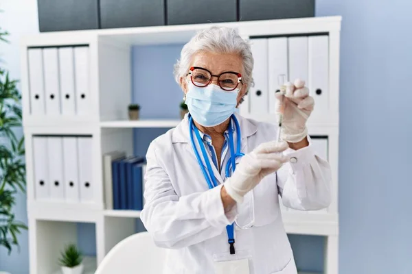 Senior Grey Haired Woman Wearing Doctor Uniform Medical Mask Holding — Stock Photo, Image