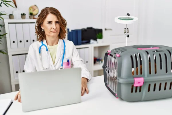 Middle Age Veterinarian Woman Working Pet Clinic Skeptic Nervous Frowning — Photo