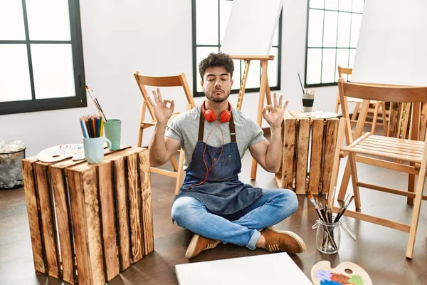 Young Hispanic Man Sitting Art Studio Relax Smiling Eyes Closed — Stockfoto