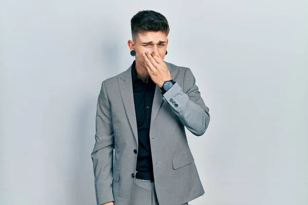 Young Caucasian Boy Ears Dilation Wearing Business Jacket Smelling Something —  Fotos de Stock