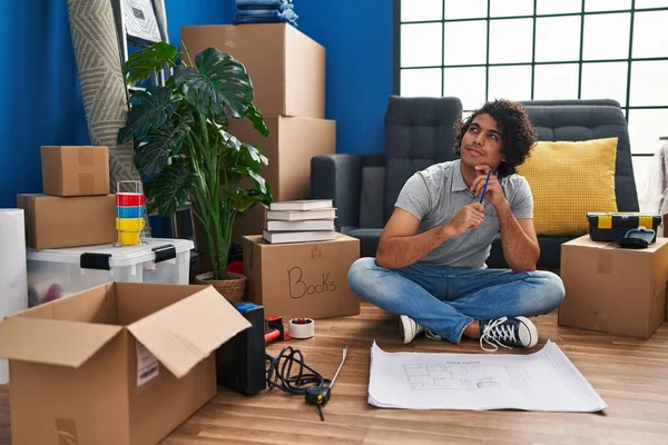 Young Hispanic Man Having Idea Writing House Plan New Home — Fotografia de Stock