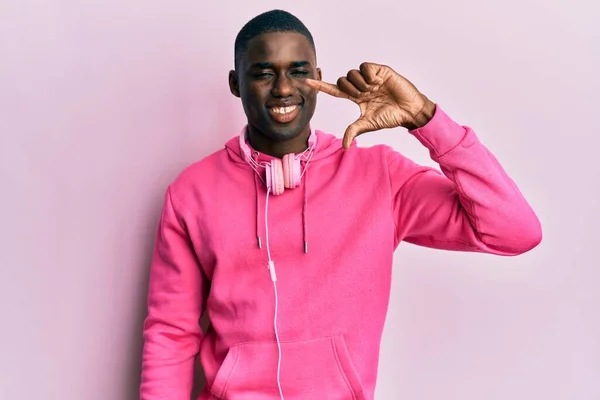 Young African American Man Wearing Gym Clothes Using Headphones Smiling — Stok fotoğraf