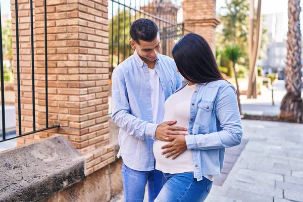 Young Latin Couple Expecting Baby Touching Belly Street — Zdjęcie stockowe