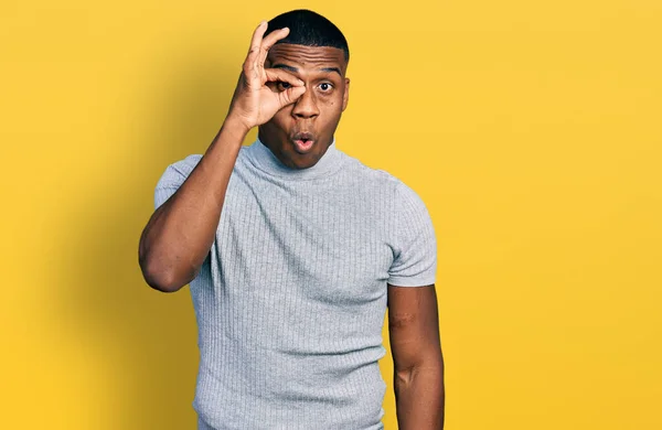 Young Black Man Wearing Casual Shirt Doing Gesture Shocked Surprised — Stockfoto
