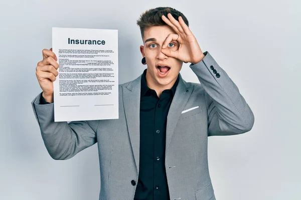 Young Caucasian Boy Ears Dilation Holding Insurance Document Smiling Happy — Φωτογραφία Αρχείου