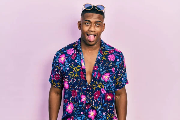 Young Black Man Wearing Hawaiian Shirt Sunglasses Sticking Tongue Out — Stock Fotó
