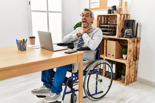 Middle Age Hispanic Man Working Office Sitting Wheelchair Shouting Suffocate — Stock Photo, Image