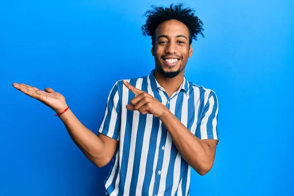 Young African American Man Beard Wearing Casual Striped Shirt Amazed — Stock Photo, Image