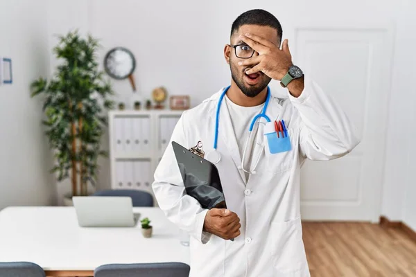 Young Indian Man Wearing Doctor Uniform Stethoscope Peeking Shock Covering — Stock Photo, Image