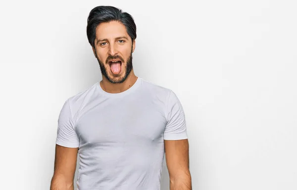 Joven Hombre Hispano Vistiendo Camiseta Blanca Casual Sacando Lengua Feliz —  Fotos de Stock