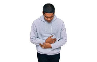 Genç, yakışıklı İspanyol bir adam, hazımsızlık, acı veren hastalıklar yüzünden eli karnında sıradan bir kazak giyiyor. Ağrı kavramı. 