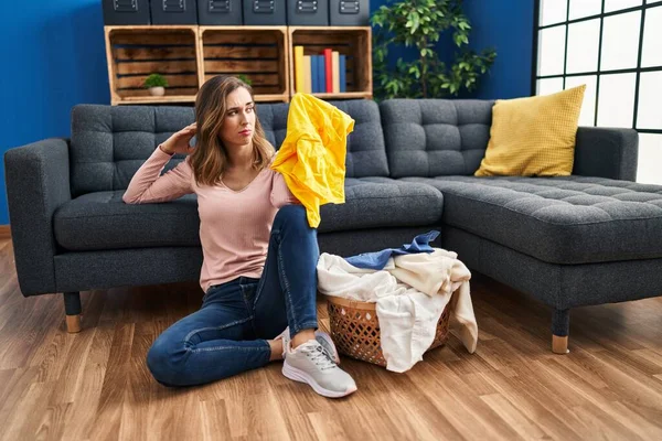 Young Woman Unhappy Doing Laundry Home — Stockfoto