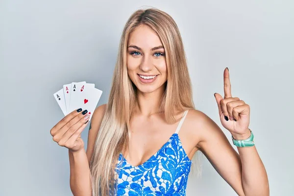 Young Beautiful Caucasian Woman Holding Poker Cards Smiling Idea Question — Stok fotoğraf