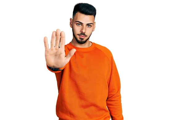 Young Hispanic Man Beard Wearing Casual Orange Sweater Doing Stop — Foto Stock