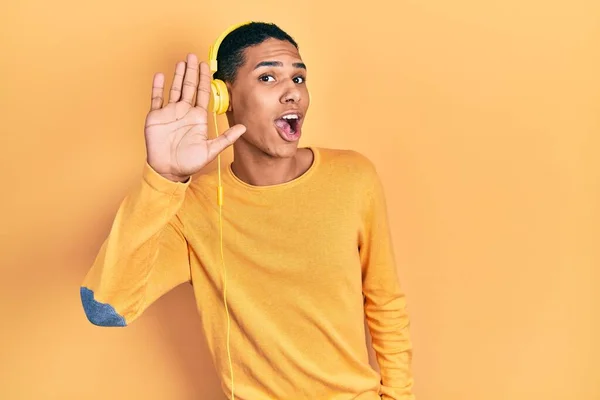 Young African American Guy Listening Music Using Headphones Waiving Saying — Foto de Stock