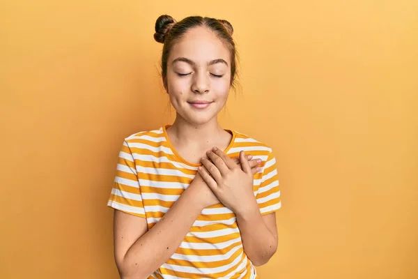 Beautiful Brunette Little Girl Wearing Casual Striped Shirt Smiling Hands — стоковое фото