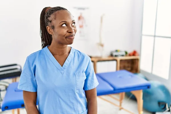 Black Woman Braids Working Pain Recovery Clinic Smiling Looking Side — 스톡 사진